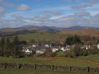 Dalry Village looking towards The Rhinns of Kells mountain range